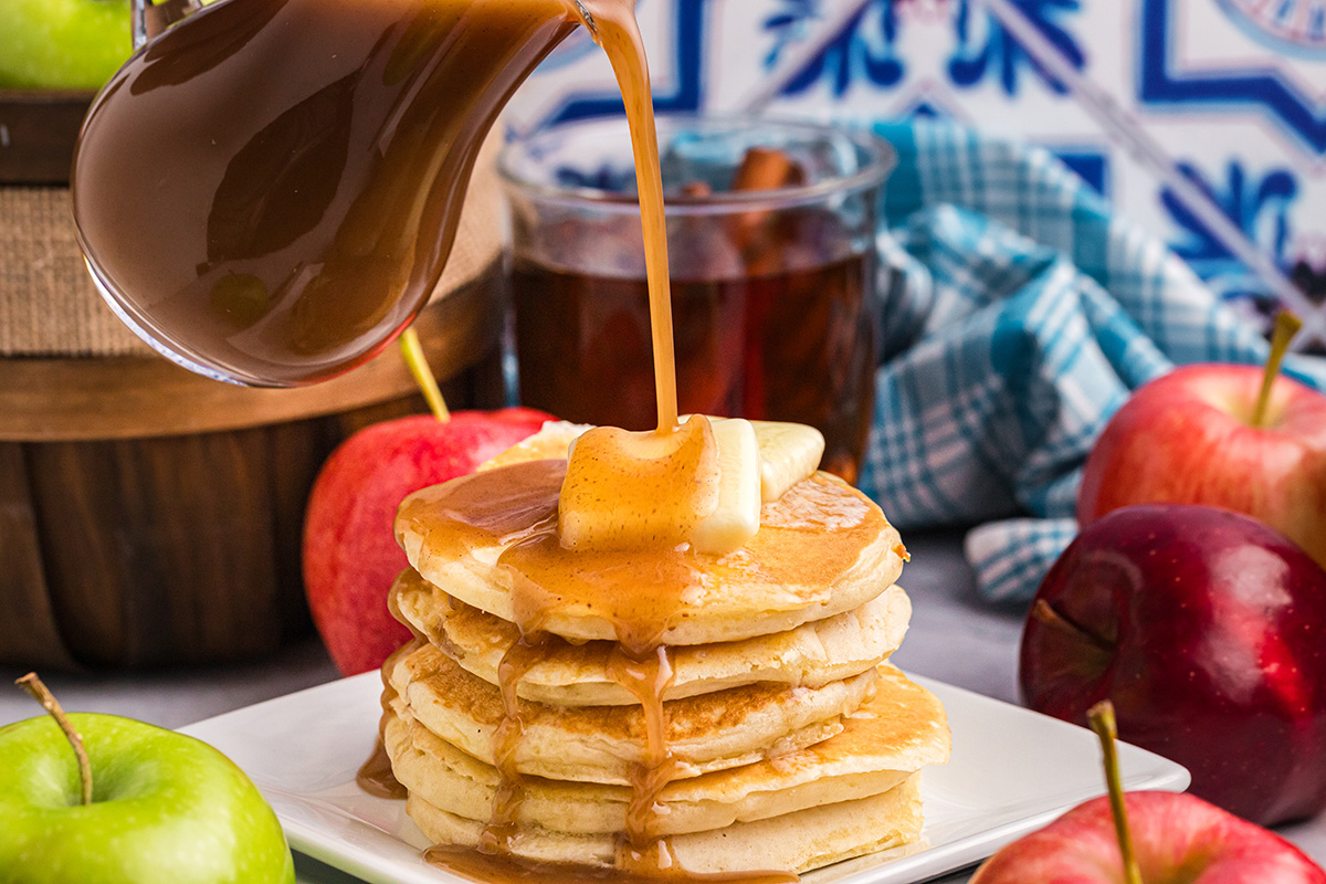 syrup poured over stack of pancakes