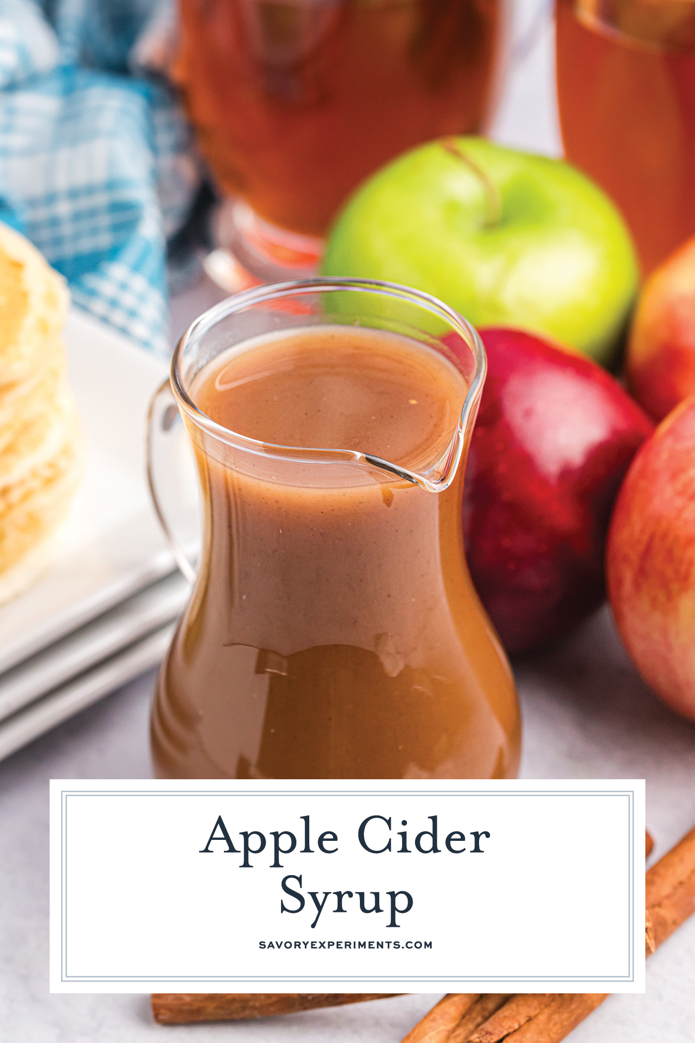 angled shot of apple cider syrup with text overlay for pinterest