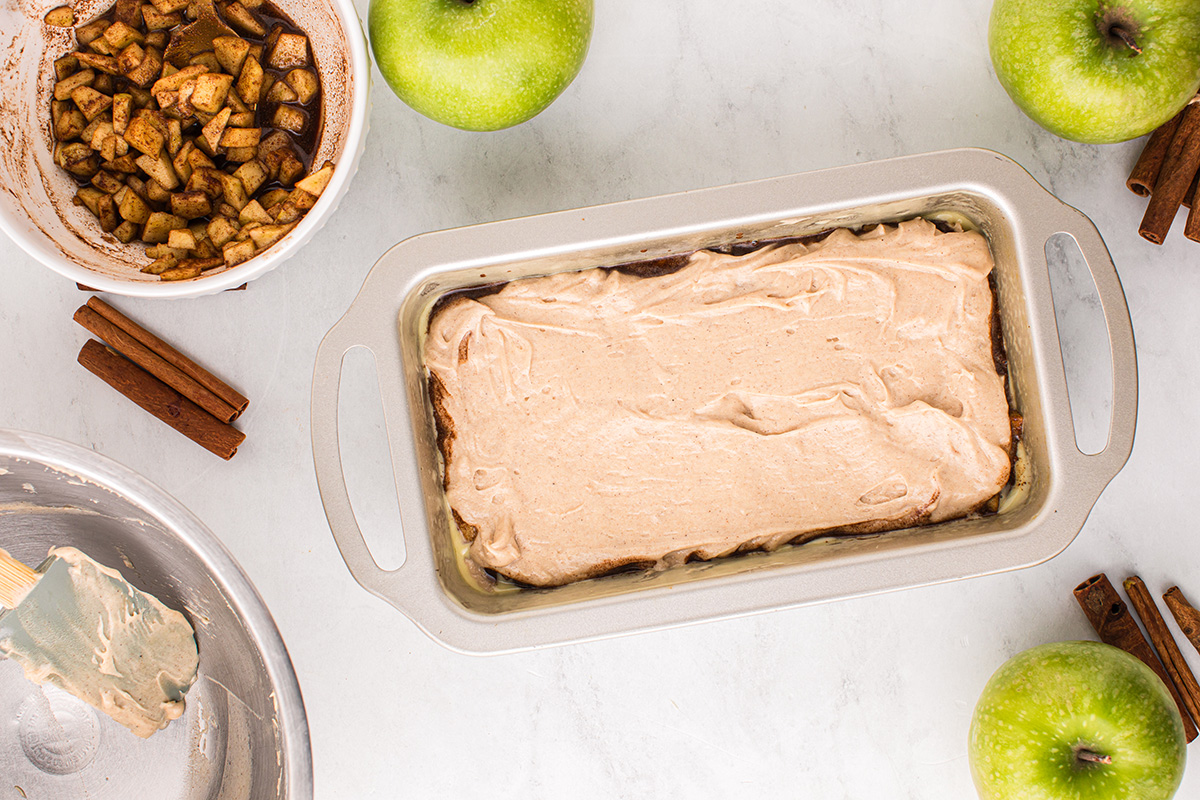 batter on top of apple layer in bread pan