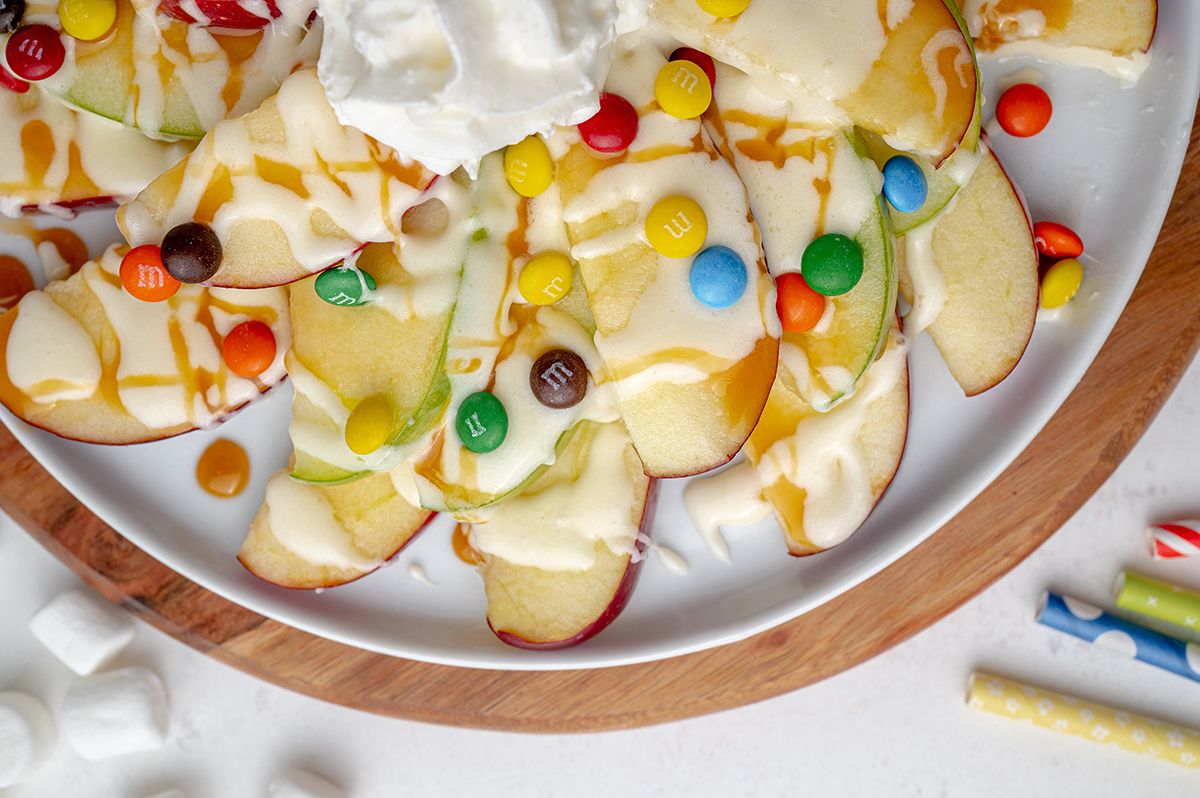 close up of apple nachos with candy