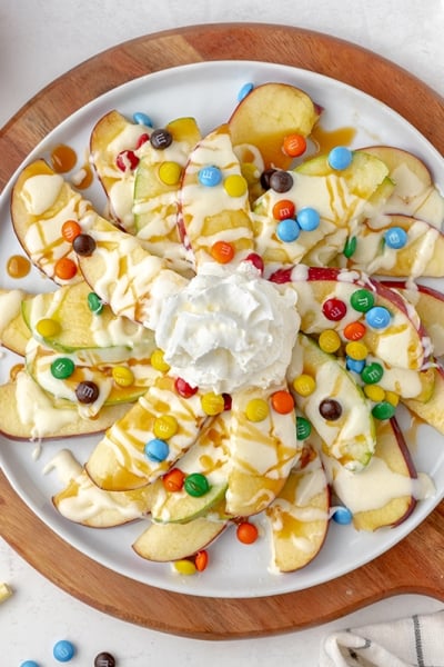 overhead hero of apple nachos recipe using red and green apples