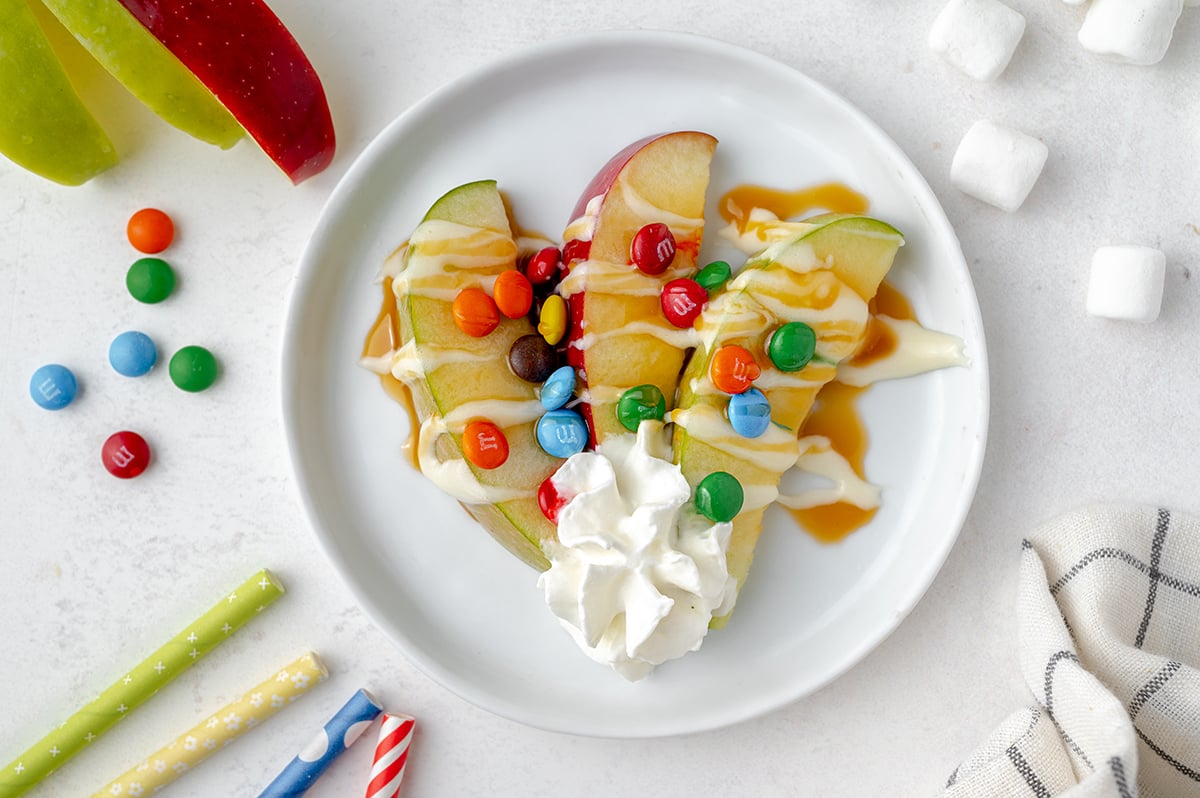 three apple slices on a white serving plates