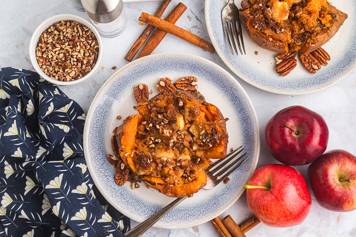 overhead shot of apple pecan stuffed sweet potato on plate