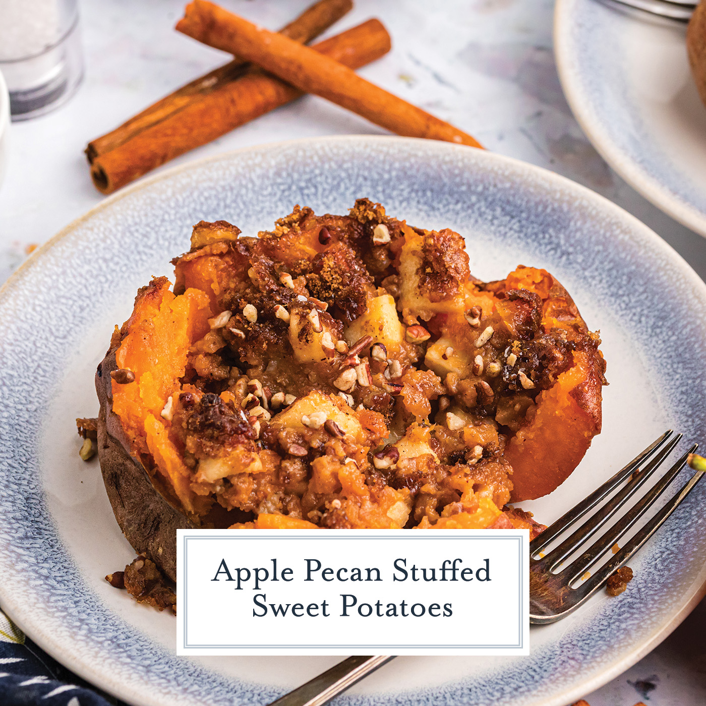 angled shot of apple spiced stuffed sweet potato on a plate with text overlay for facebook