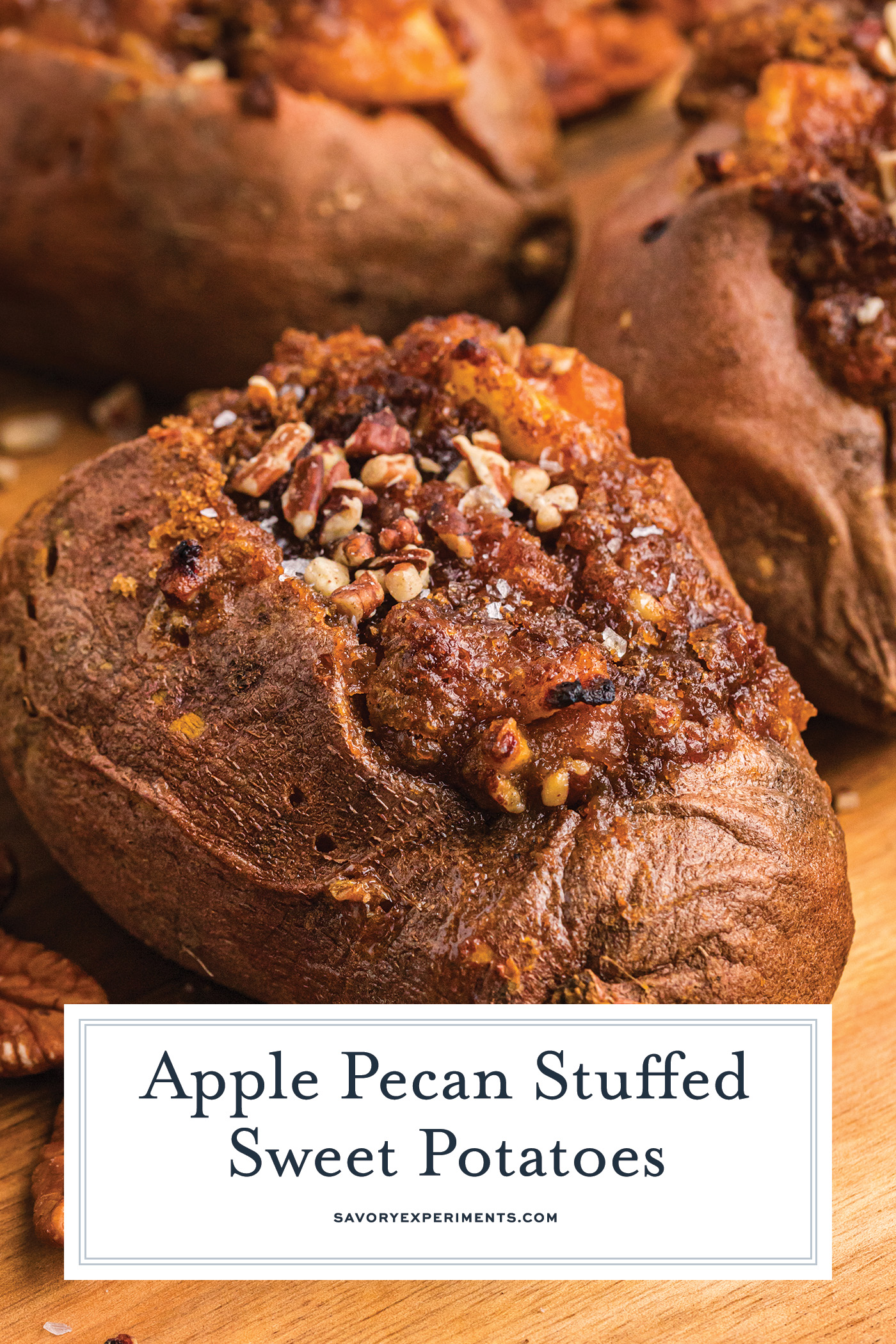 angled shot of apple pecan stuffed sweet potato on cutting board with text overlay for pitnerest