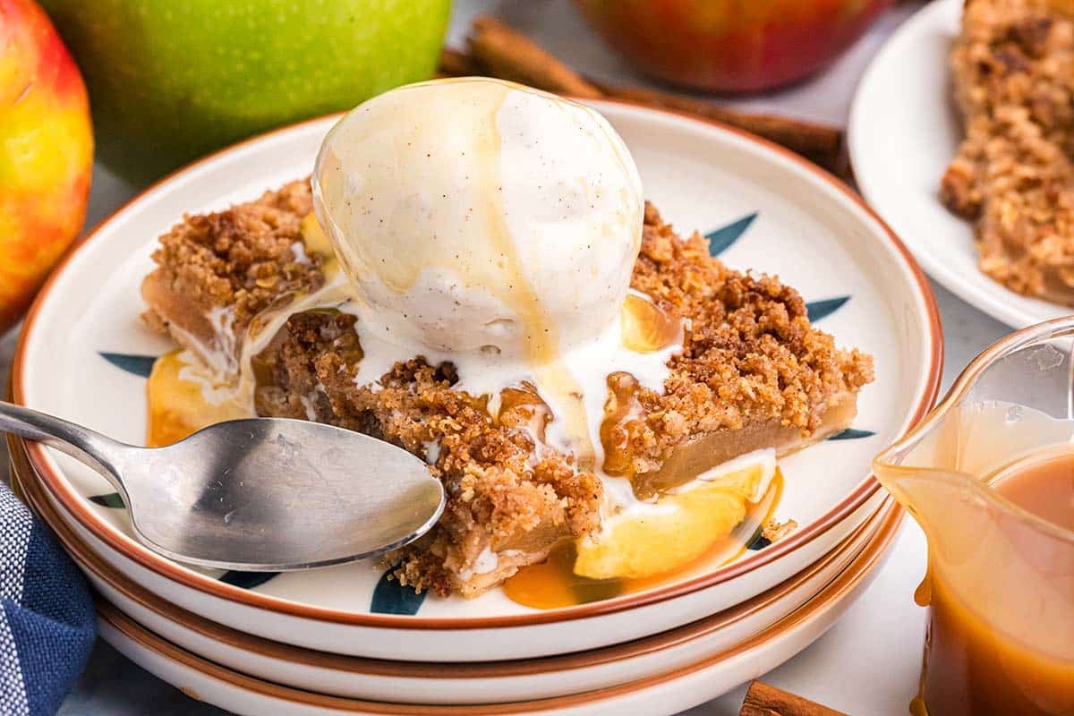 apple slab pie topped with ice cream and caramel