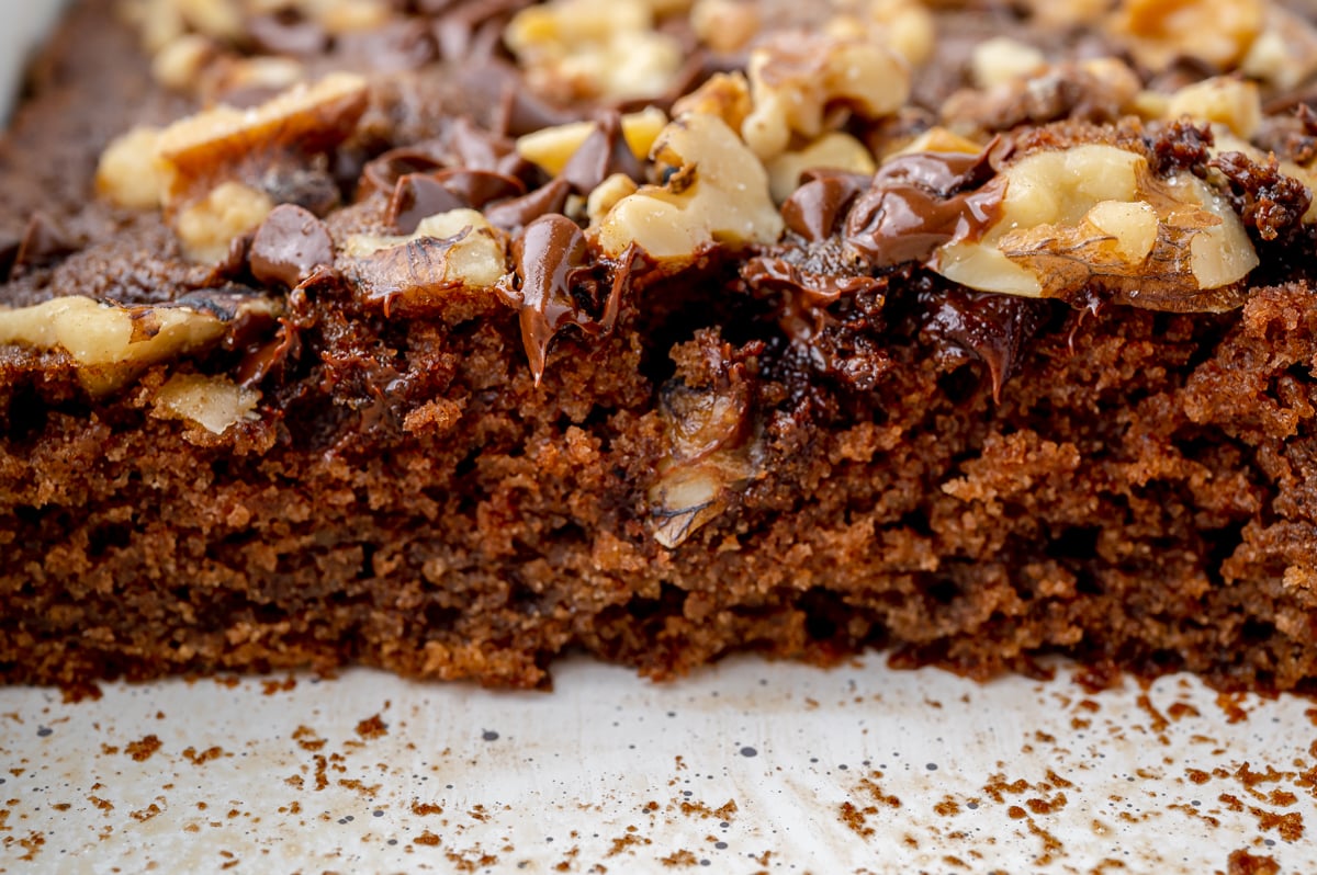cross sectional view of moist brownies using applesauce with nut topping