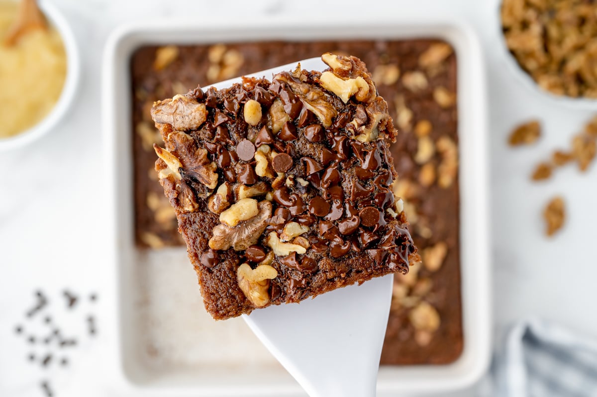 spatula holding a gooey applesauce brownie