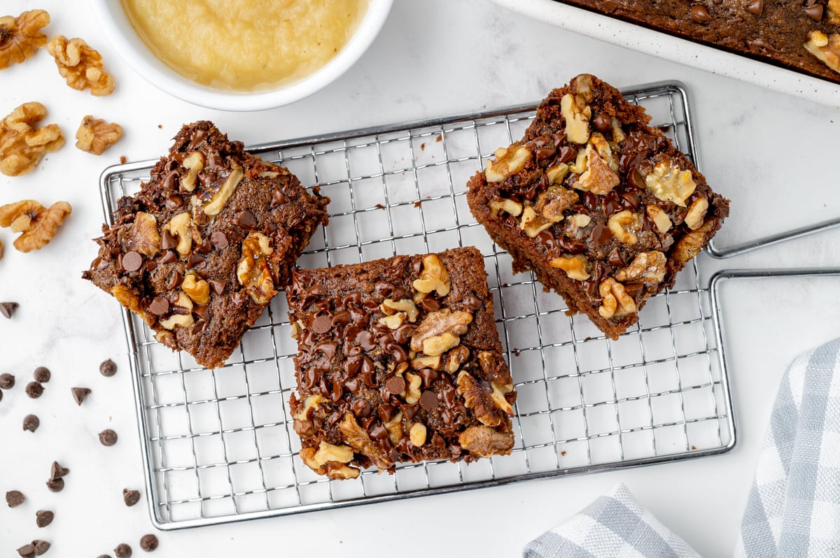 chocolate brownies with applesauce on a wire rack