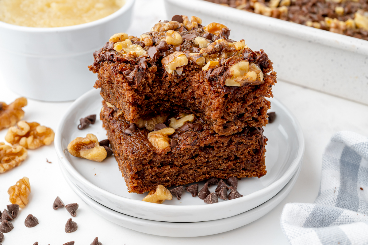 two brownies stacked on a white plate