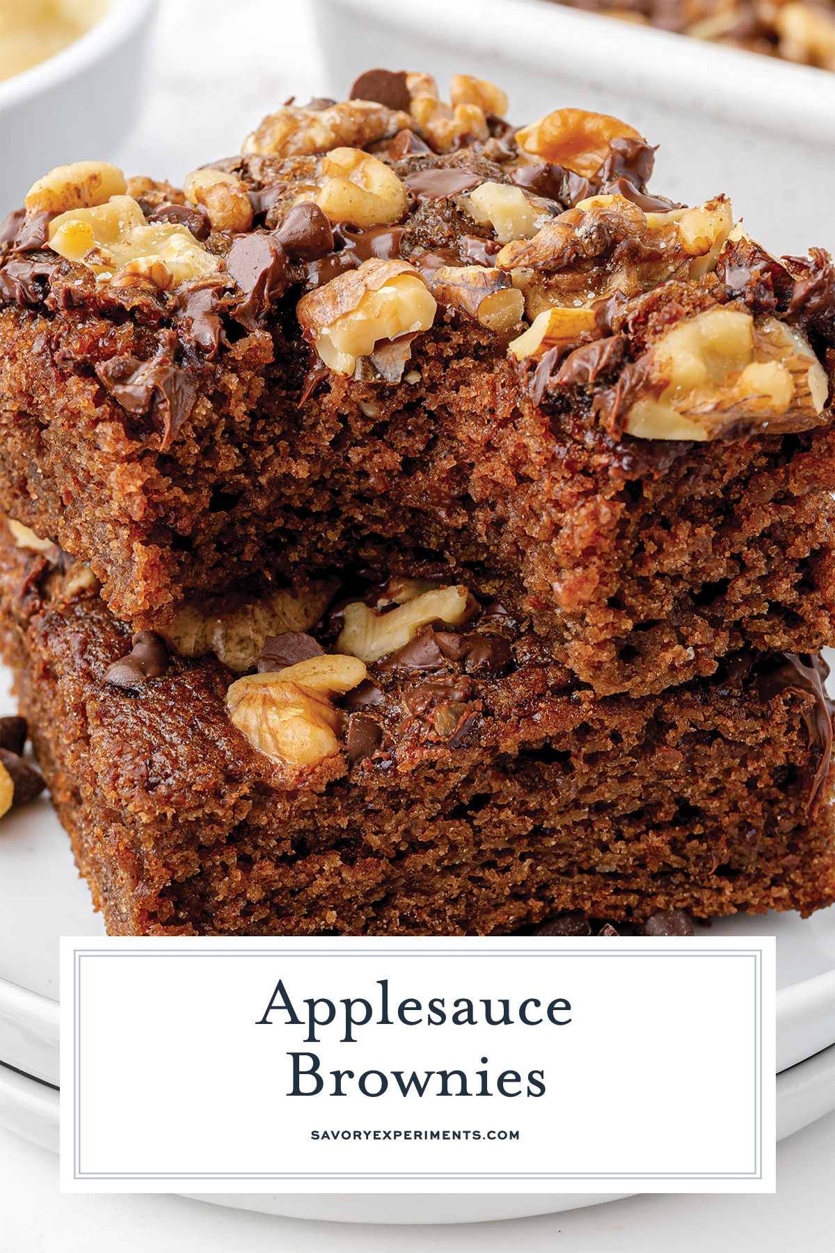 close up of brownies with bite take out with text overlay reading "applesauce brownies"