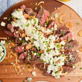 overhead shot of blue cheese sauce on sliced steak