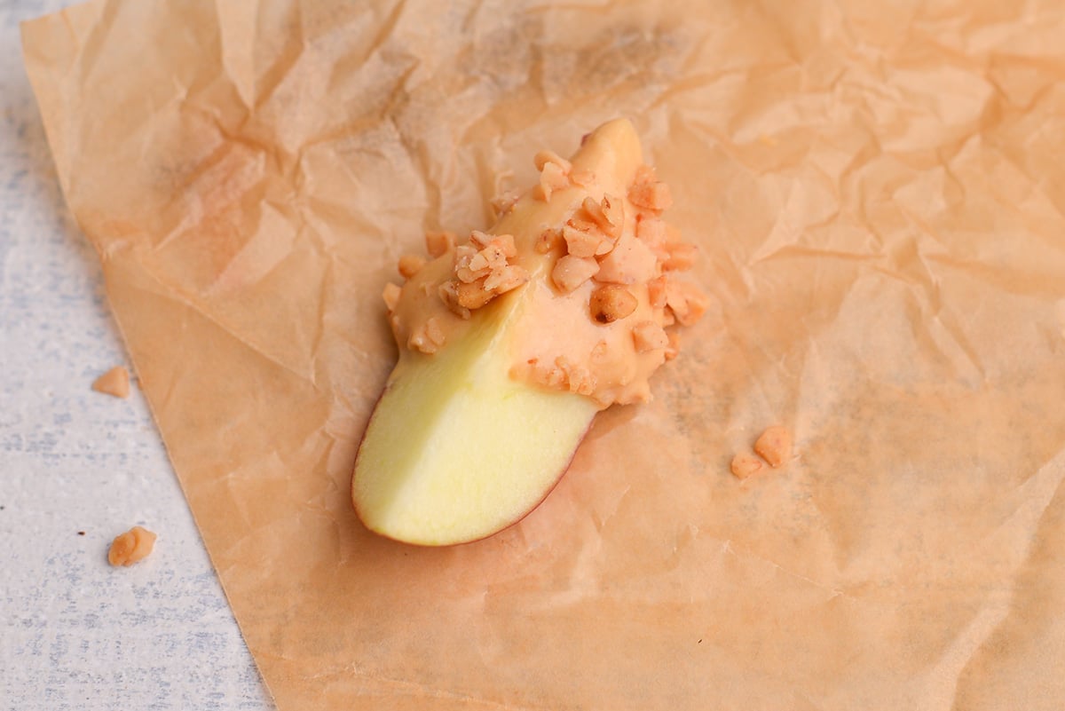 apple slice covered in dessert dip