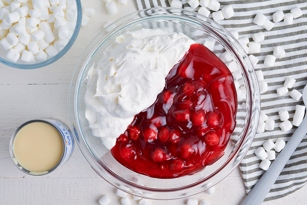 cool whip and cherry filling in a bowl