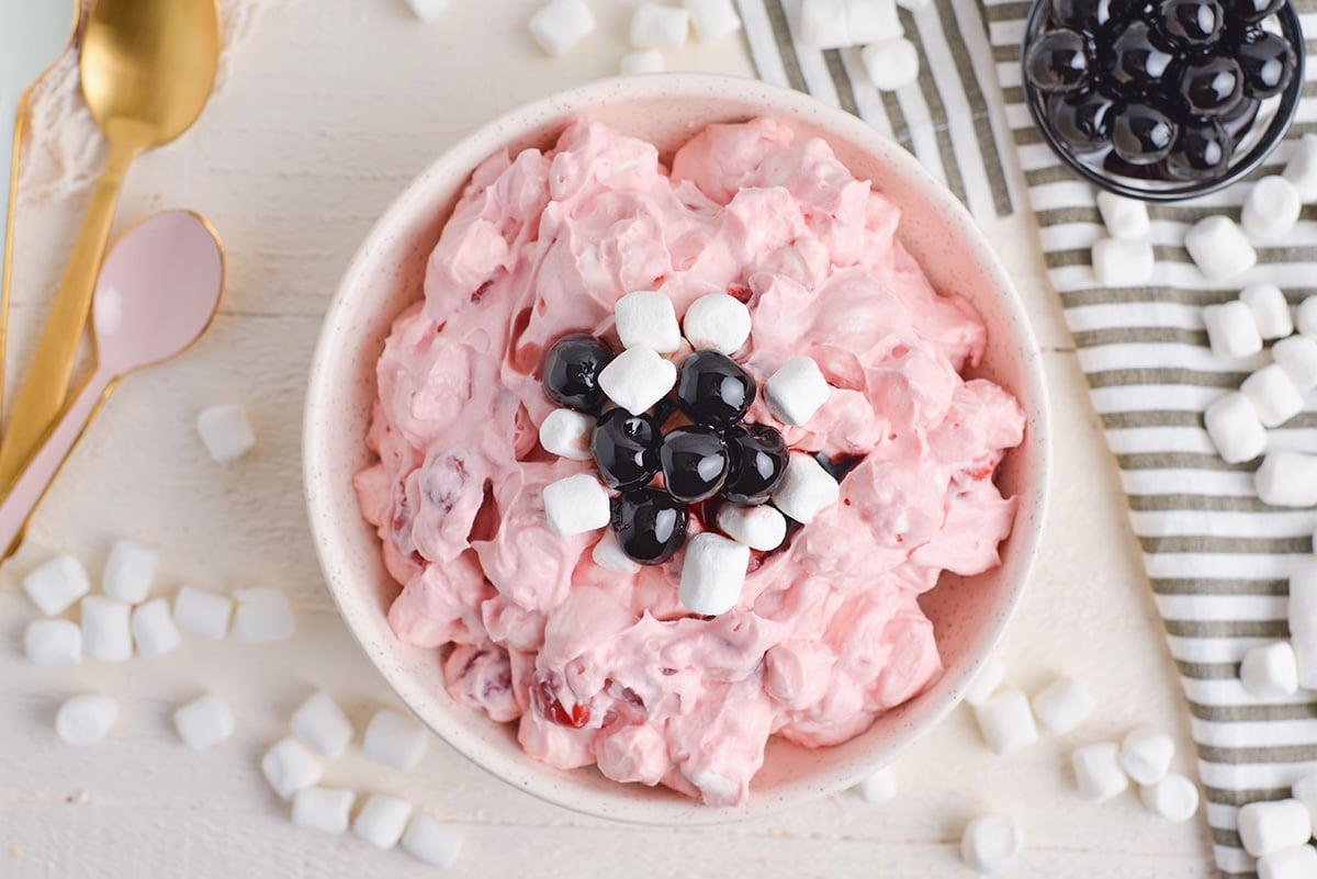 overhead shot of cherry fluff topped with marshmallows and cherries