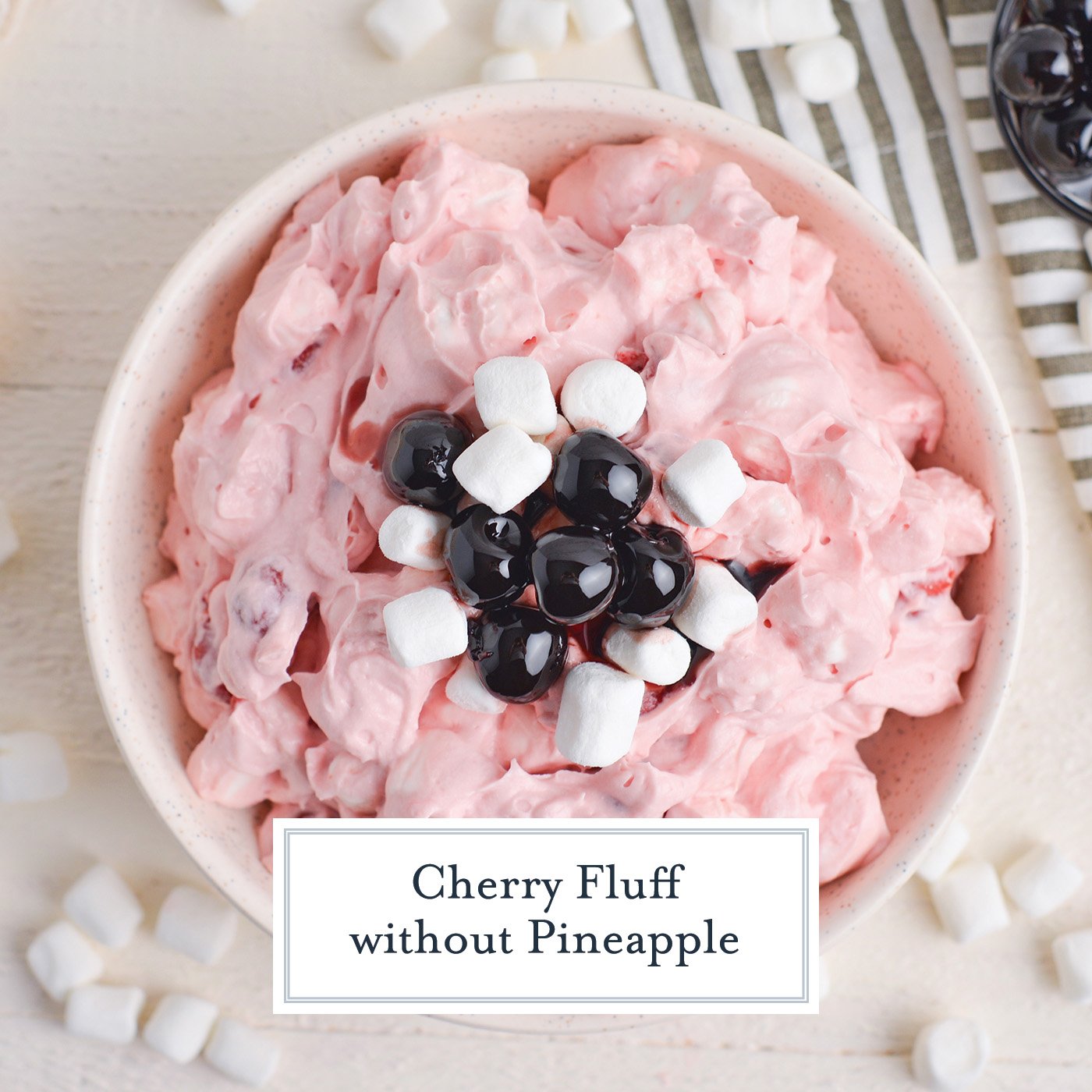 overhead shot of bowl of cherry fluff with text overlay for facebook