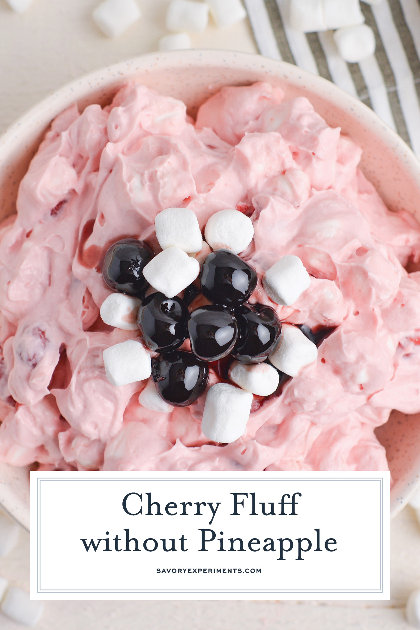 overhead shot of bowl of cherry fluff without pineapple with text overlay for pinterest