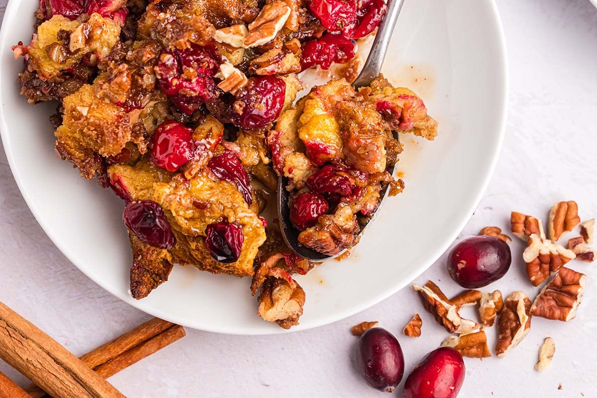 close up overhead shot of french toast casserole on plate with spoon