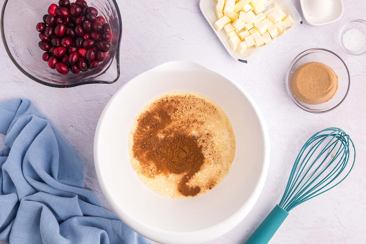 overhead shot of cinnamon added to custard