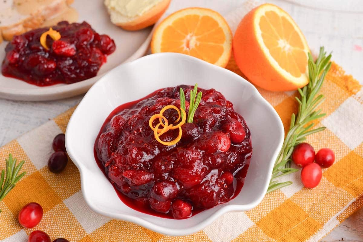angle of fresh cranberry sauce in a white serving bowl