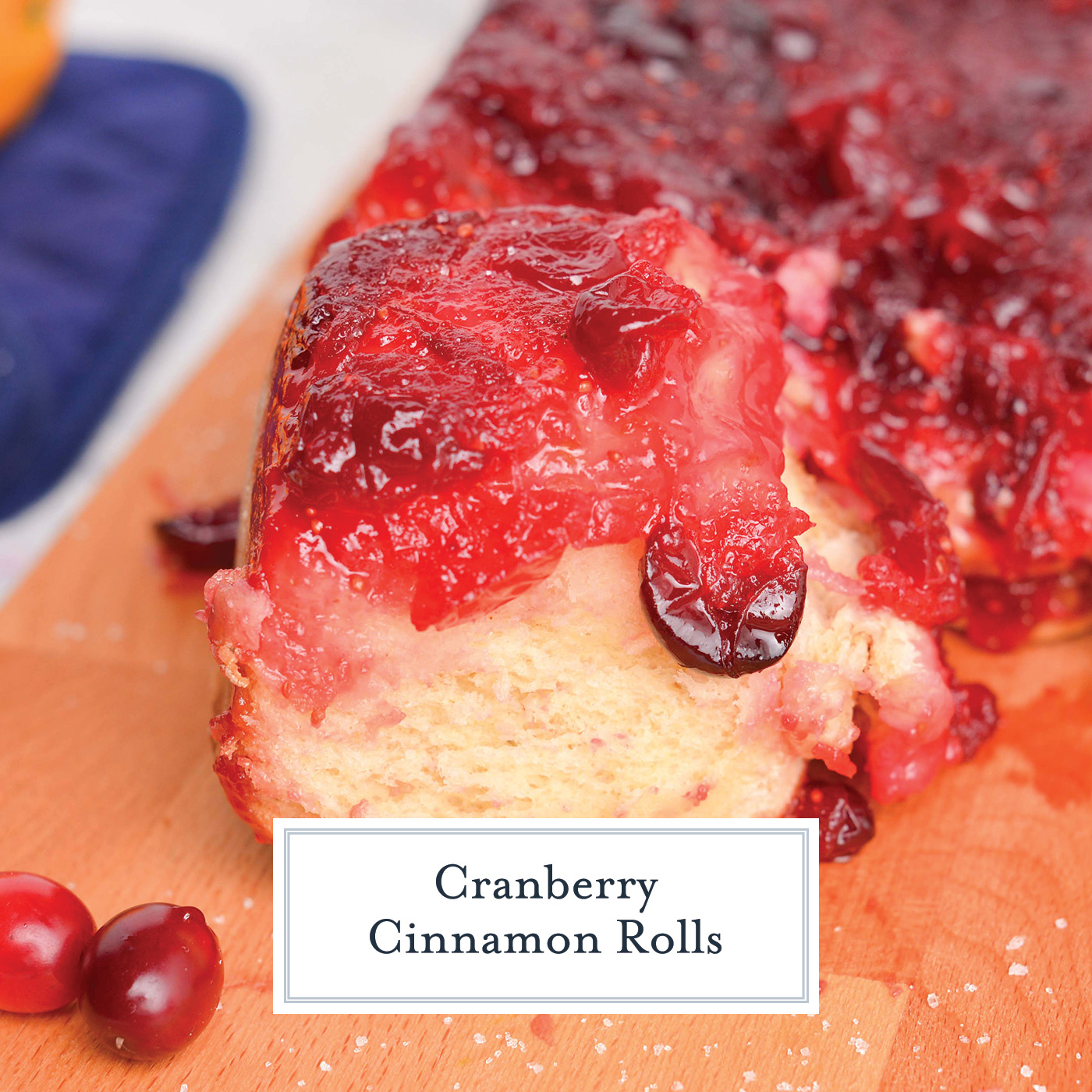 close up angled shot of cranberry cinnamon roll with text overlay for facebook