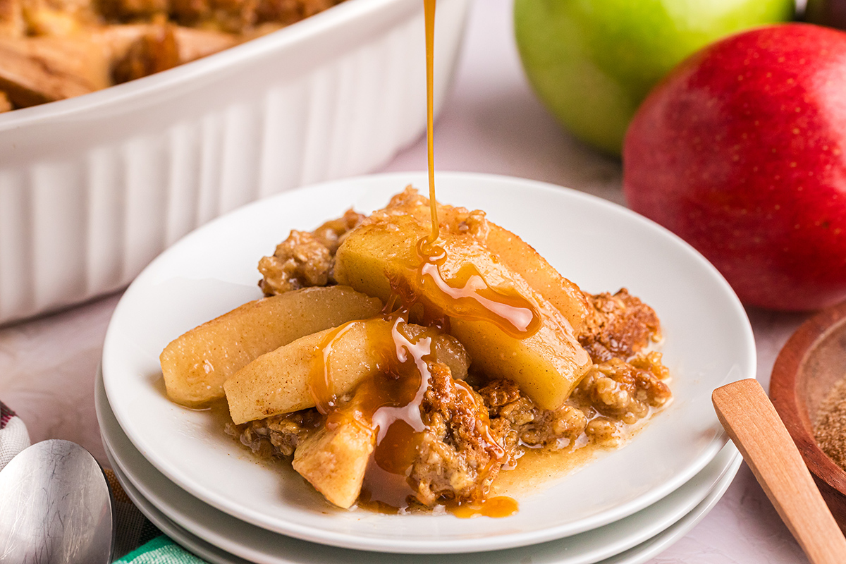 caramel drizzled onto apple crisp dessert