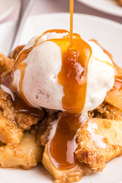 close up of caramel drizzled onto apple crisp