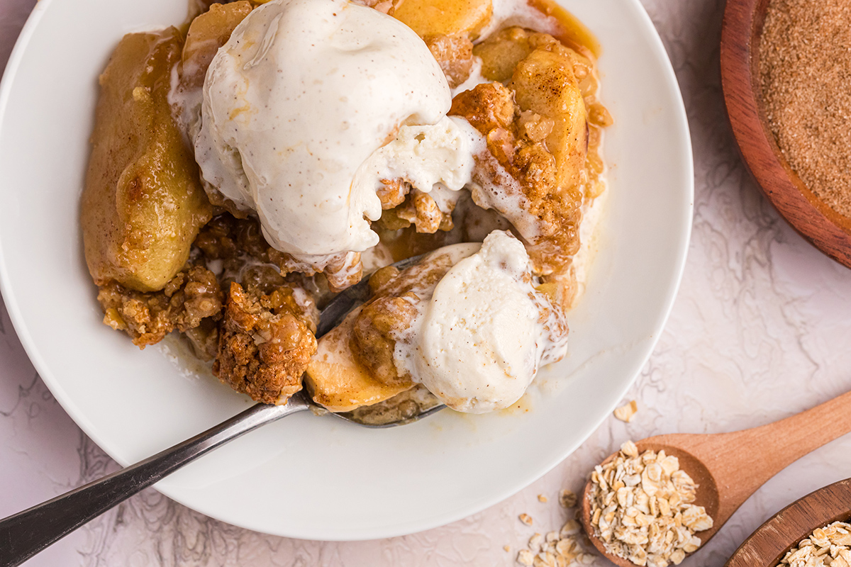 overhead shot of bite of apple crisp on spoon