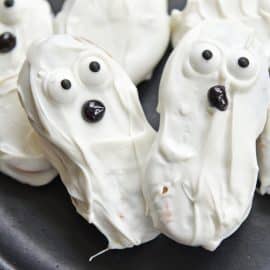 close up of ghost cookies on plate