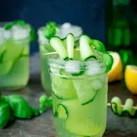 straight on shot of gin and cucumber basil smash cocktail