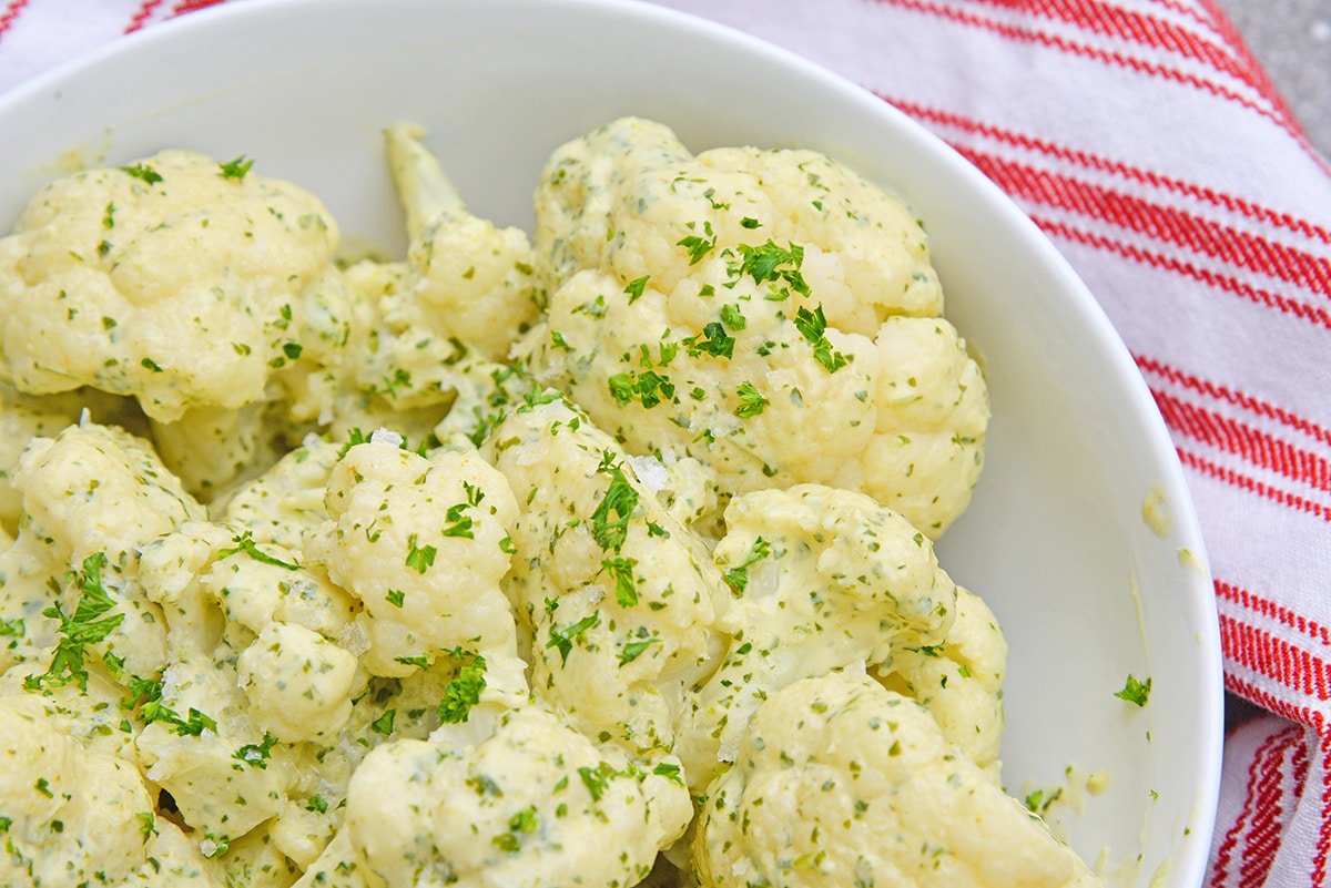 close up of cauliflower with green curry sauce