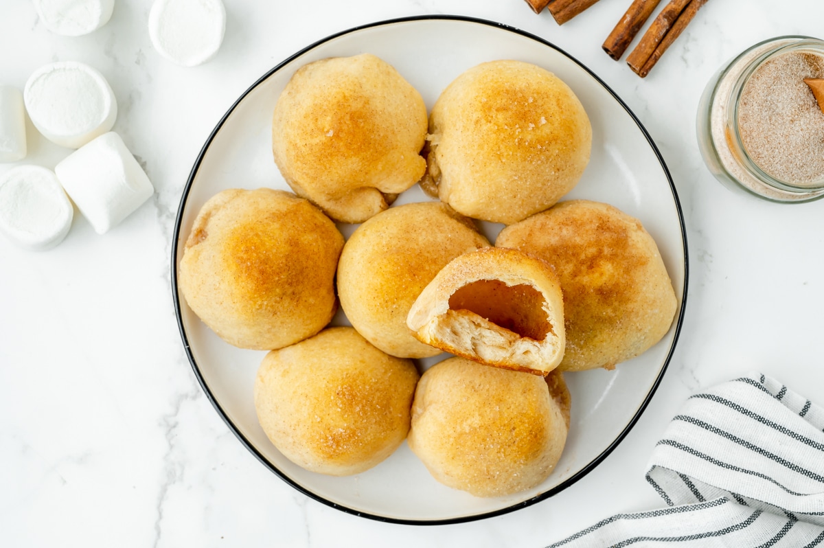 bite taken out of plate of hocus pocus buns