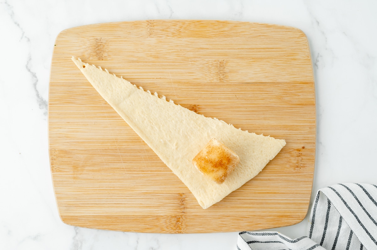 marshmallow placed on raw dough