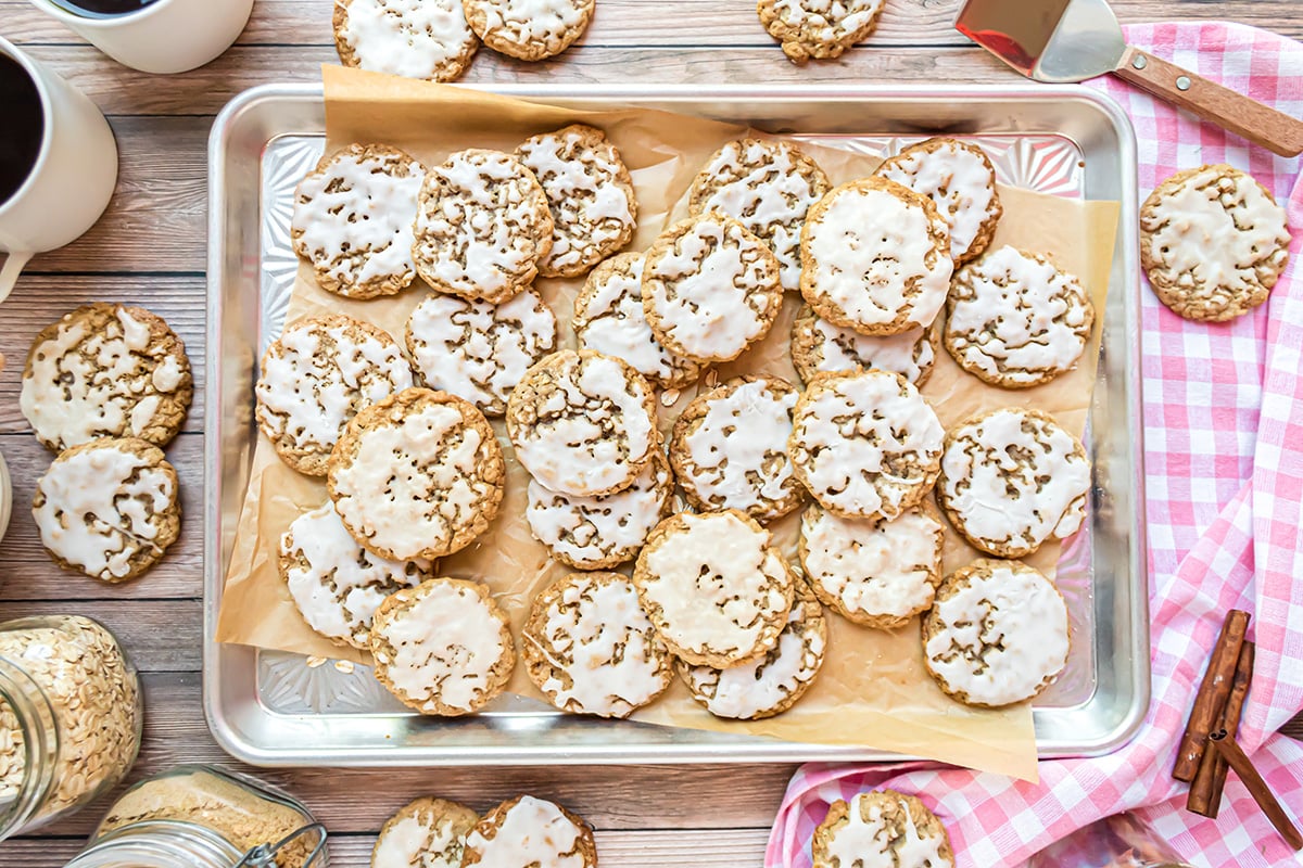 baking sheet with parchment and cookies with a pink linen