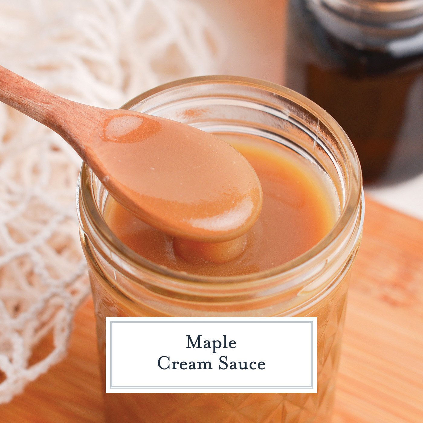 spoon in jar of maple cream sauce with text overlay for facebook