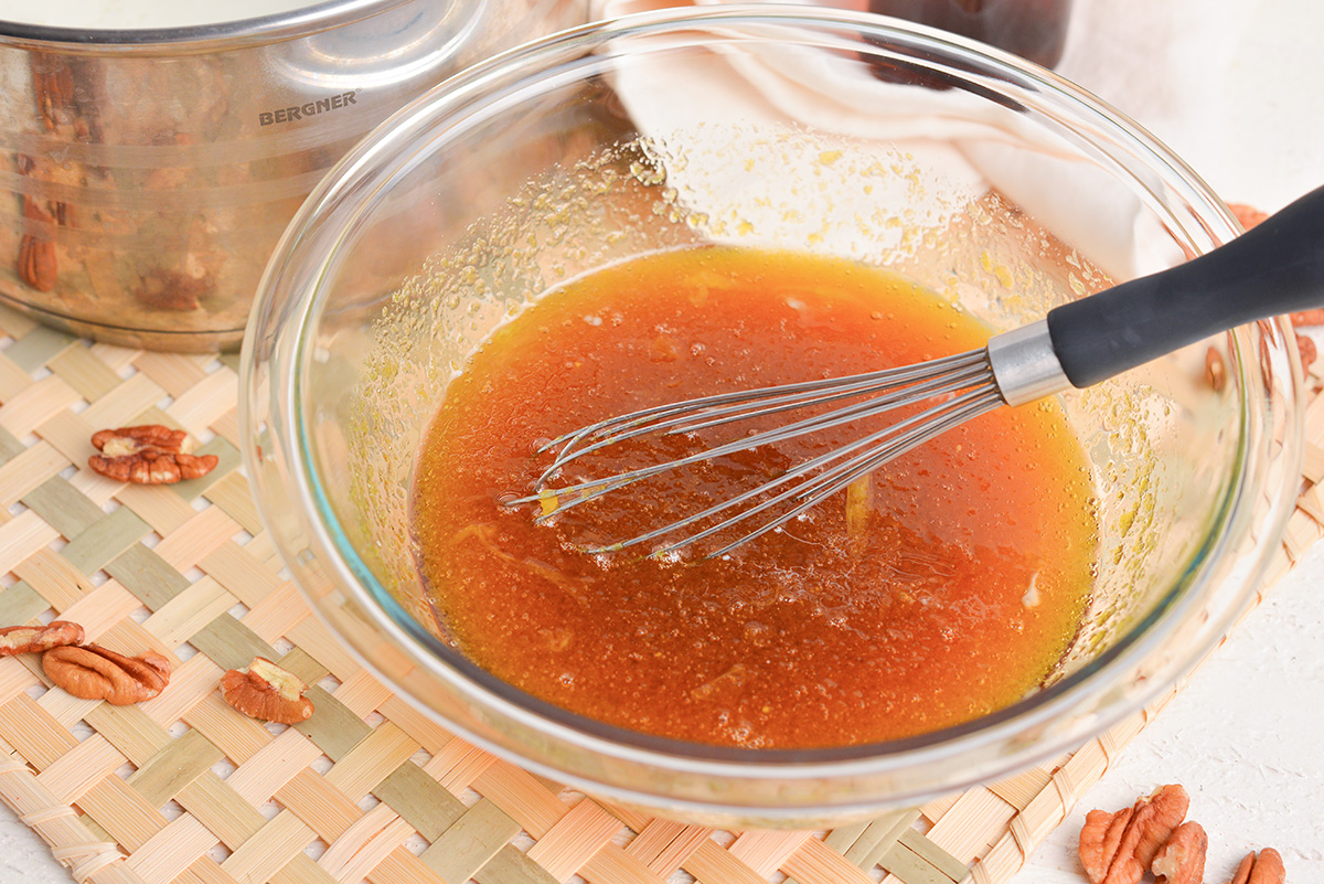 maple flavoring in bowl with whisk