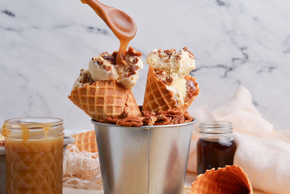 sauce spooned onto ice cream cones