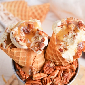 close up angled shot of maple ice cream in cones