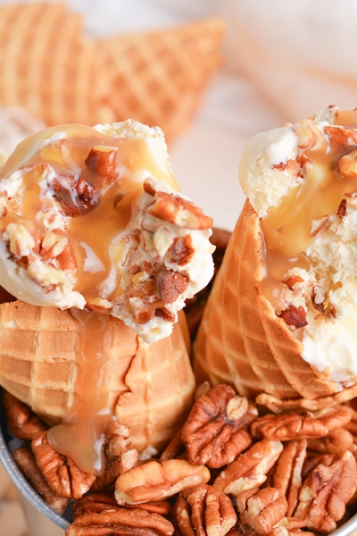 close up angled shot of maple ice cream in cones