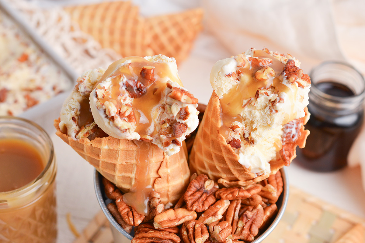 close up angled shot of maple ice cream in cones