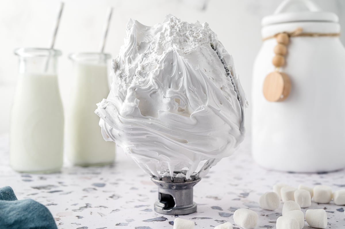Homemade marshmallow fluff on a whisk