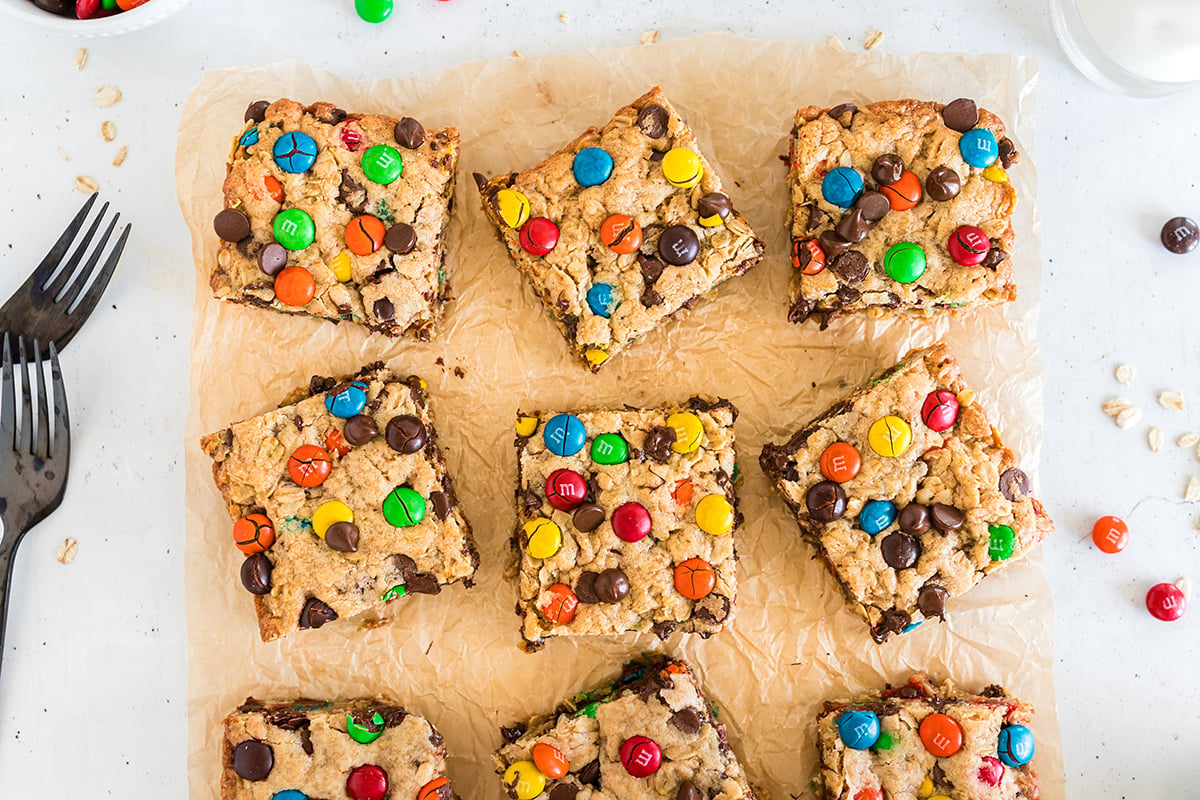 overhead shot of monster cookie bars on parchment paper