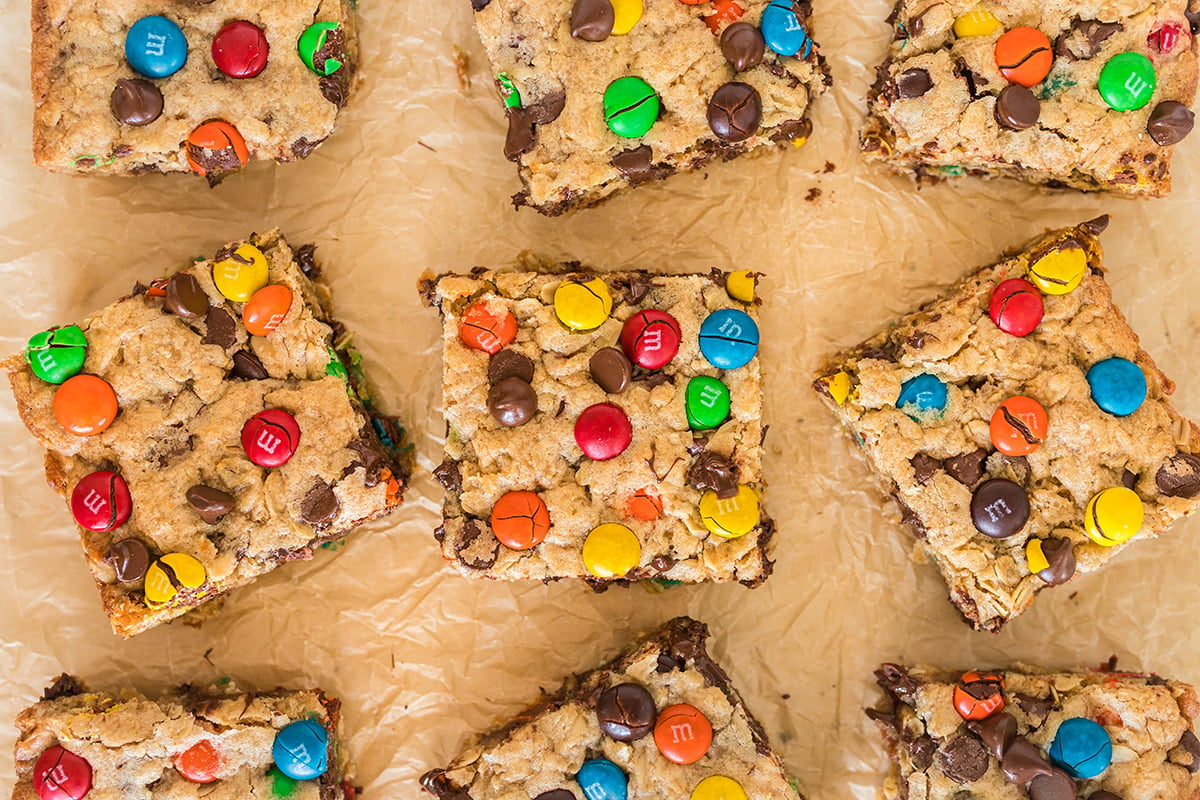 close up overhead shot of monster cookie bars on parchment paper