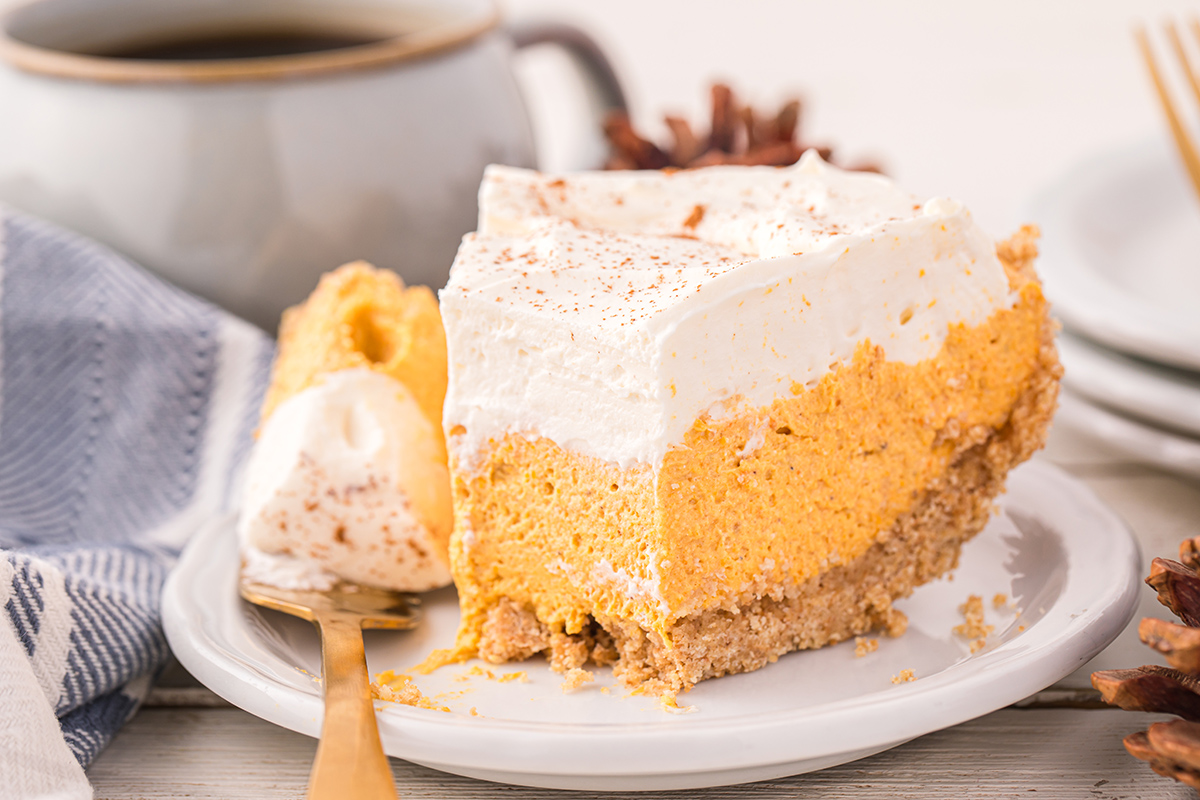 straight on shot of slice of pumpkin mousse pie on plate