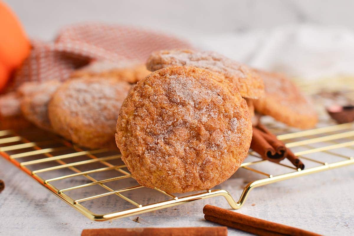 straight on shot of pumpkin snickerdoodles on cooling rack