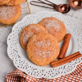 angled shot of three cookies on a plate