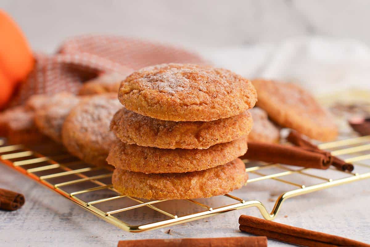 stack of pumpkin snickerdoodles on cooling rack