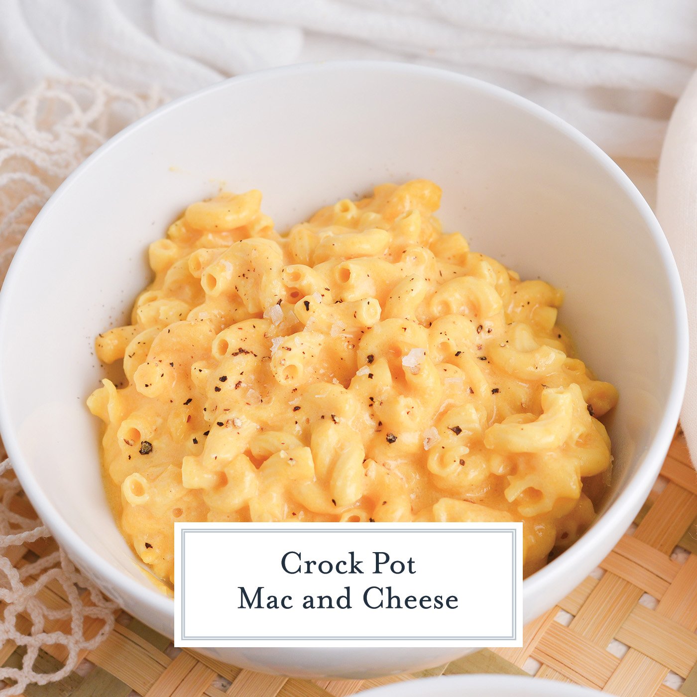 angled shot of bowl of crock pot mac and cheese with text overlay for facebook