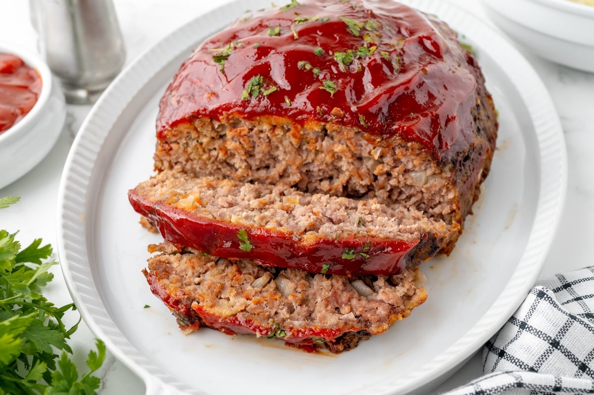 slow cooker meatloaf sliced on platter