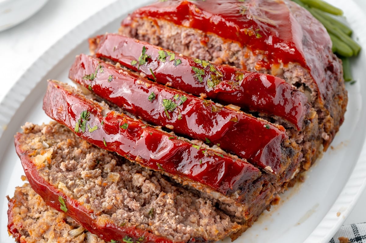close up shot of sliced meatloaf on platter